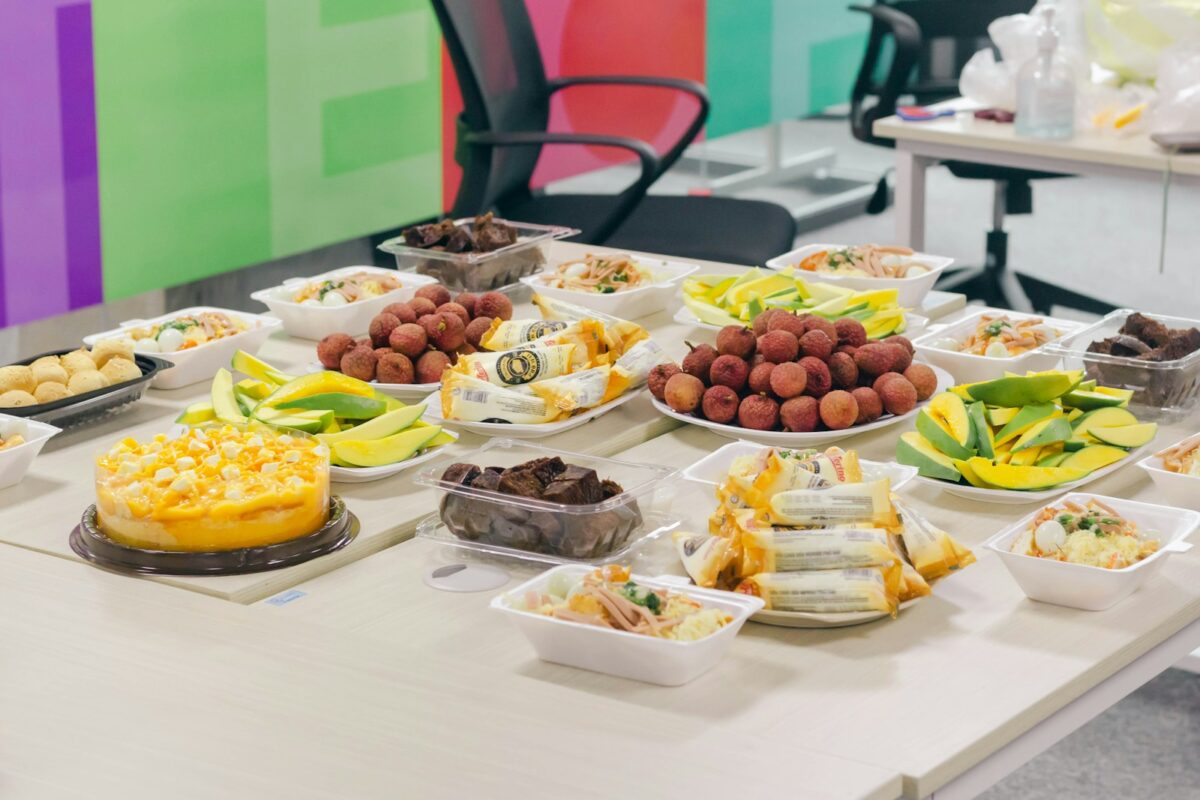 variety of foods on white table, office lunch catering